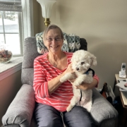 Ginny Jones holding a white dog