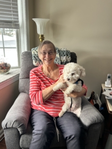 Ginny Jones holding a white dog